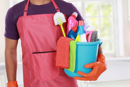 Technician preparing carpet cleaning equipment in a safe, organised setting