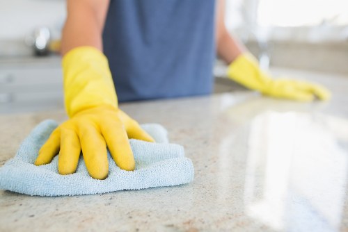 Carpet cleaning professional wearing protective gloves and mask
