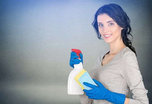 Cleaner using extraction equipment on a carpeted floor